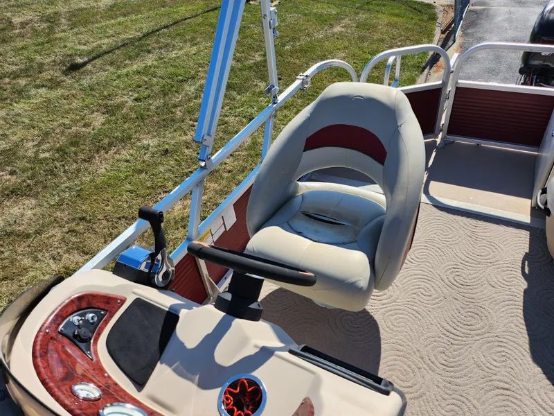 Slide: The Image of 2012 Sun Tracker Party Barge 20 DLX captain's chair and helm station. - 14