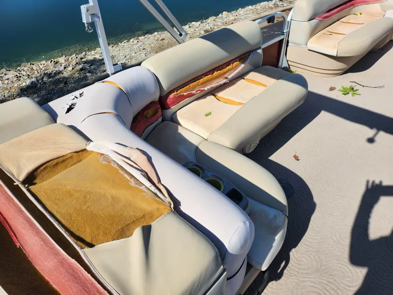 Slide: The Image of 2012 Sun Tracker Party Barge 20 DLX with damaged upholstery on deck. - 18