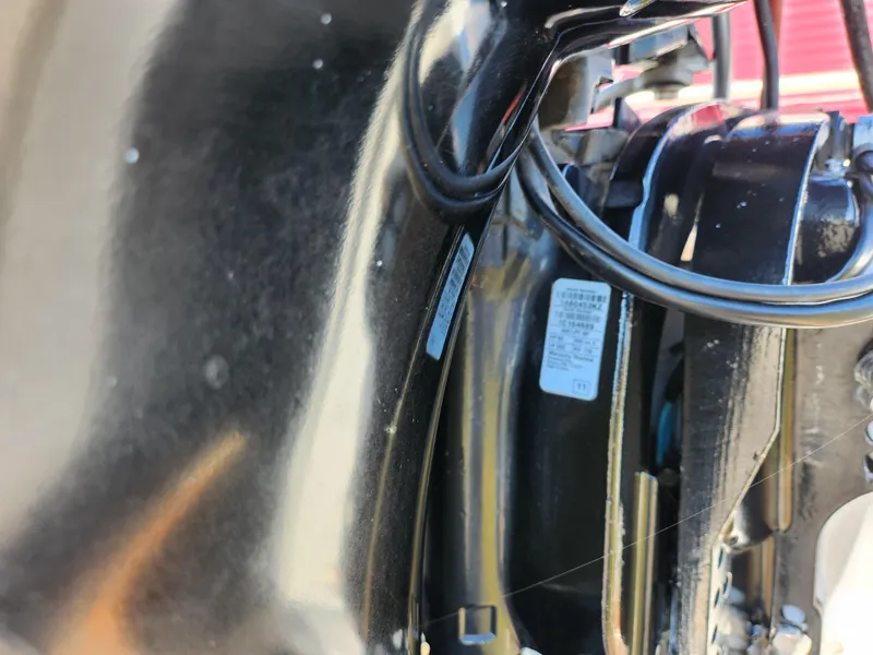 Slide: The Image of Close-up of the engine compartment of a 2012 Sun Tracker Party Barge 20 DLX. - 2