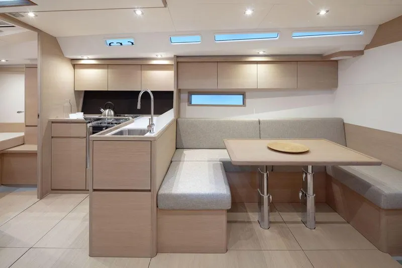 Slide: The Image of Modern interior of 2025 Solaris 44 yacht with sleek kitchen and dining area. - 7