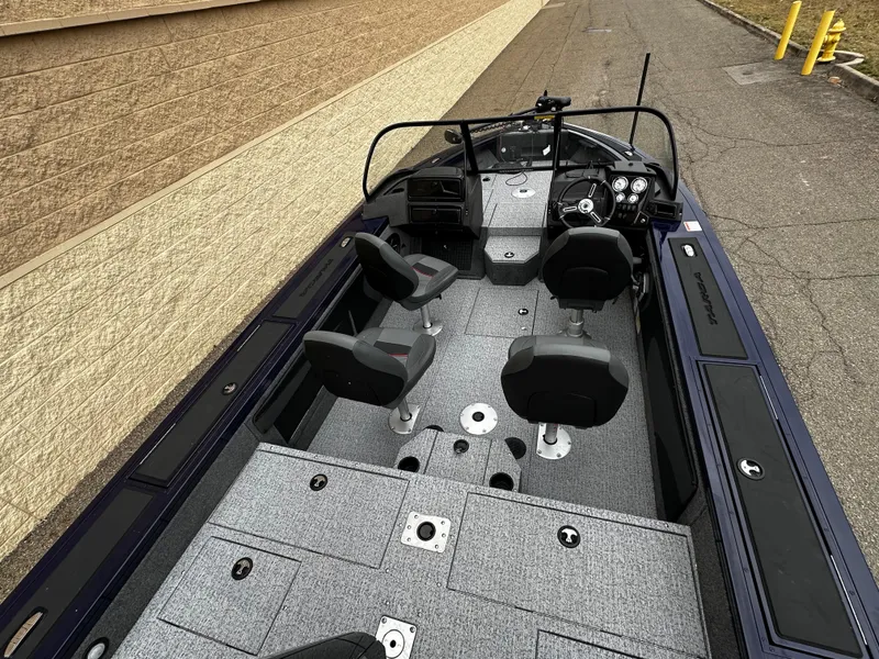 Slide: The Image of 2024 Tracker Targa V-19 WT fishing boat interior with seating and storage compartments. - 6