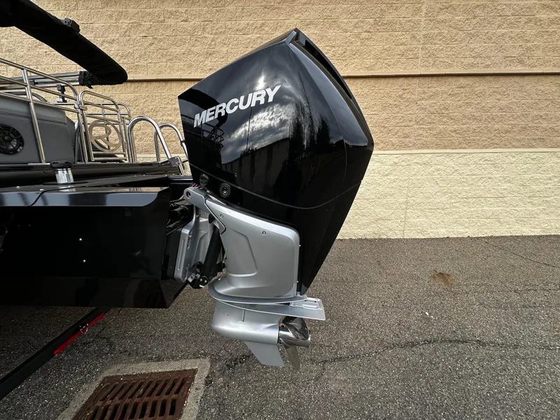 Slide: The Image of 2024 Regency 230 LE3 Sport boat with Mercury outboard motor. - 3