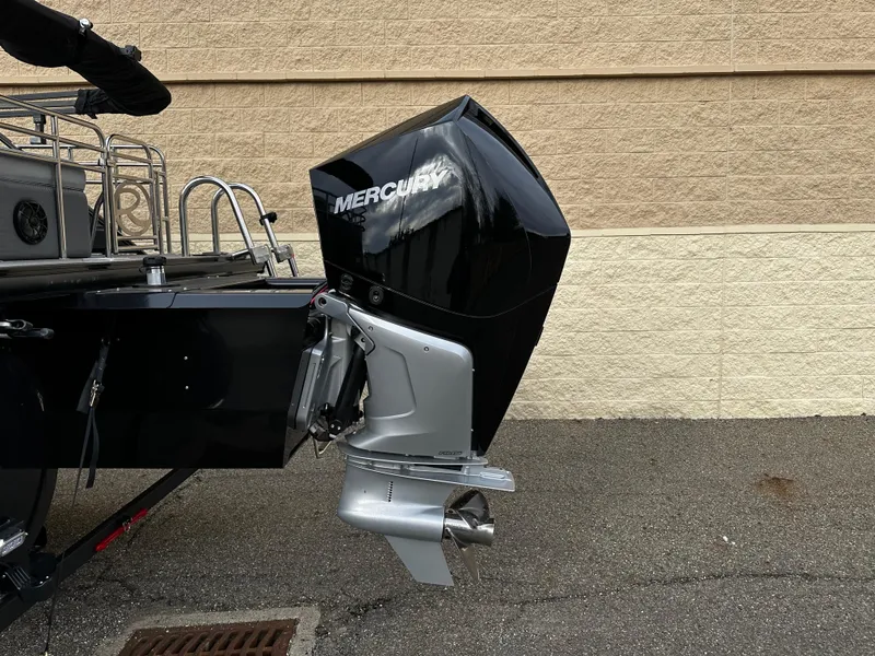 Slide: The Image of 2024 Regency 230 LE3 Sport boat with Mercury outboard motor. - 4