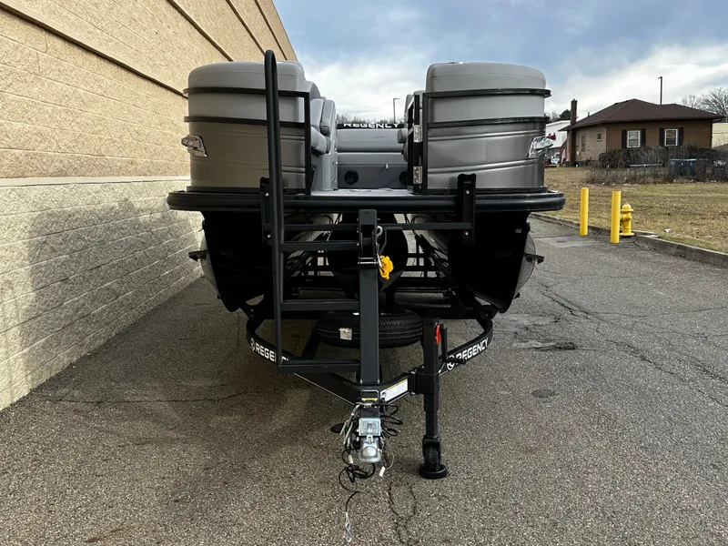 Slide: The Image of 2024 Regency 230 LE3 Sport pontoon boat on trailer, rear view. - 5