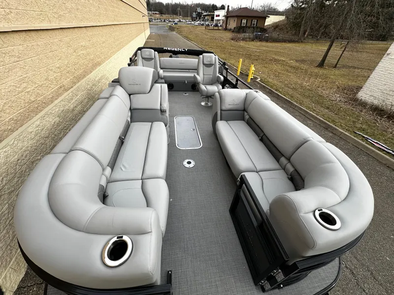 Slide: The Image of 2024 Regency 230 LE3 Sport pontoon boat with spacious seating and modern design. - 6