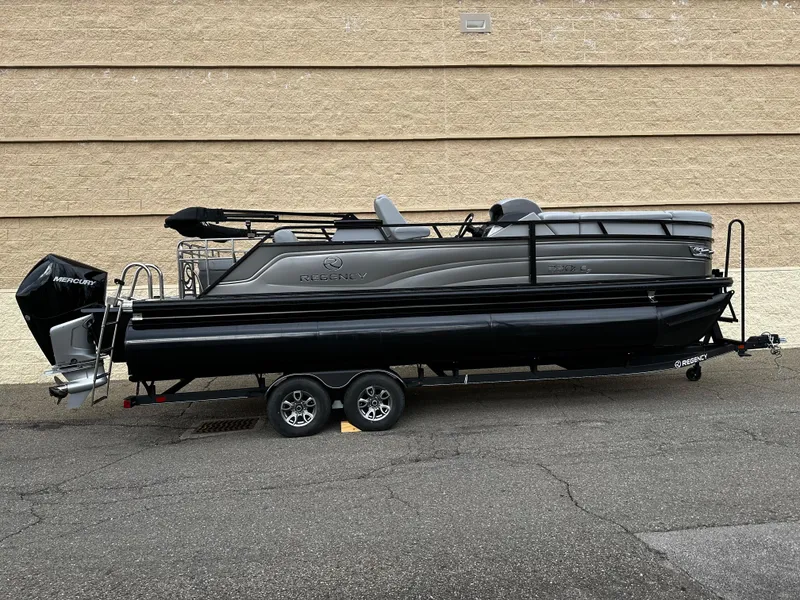 Slide: The Image of 2024 Regency 230 LE3 Sport pontoon boat on trailer, side view. - 7