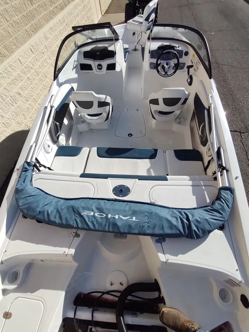 Slide: The Image of 2024 Tahoe 200 S boat interior with seating and steering console. - 4