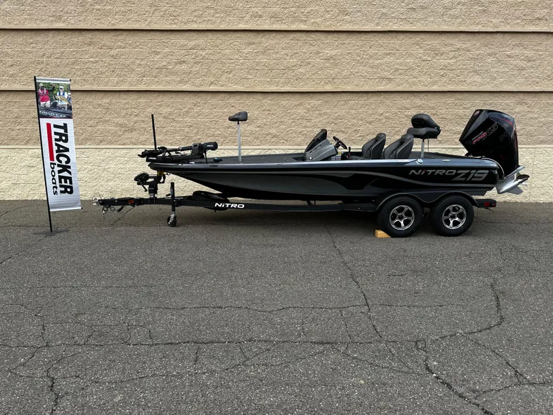 Slide: The Image of 2024 Nitro Z19 Pro fishing boat on trailer, displayed outdoors. - 0