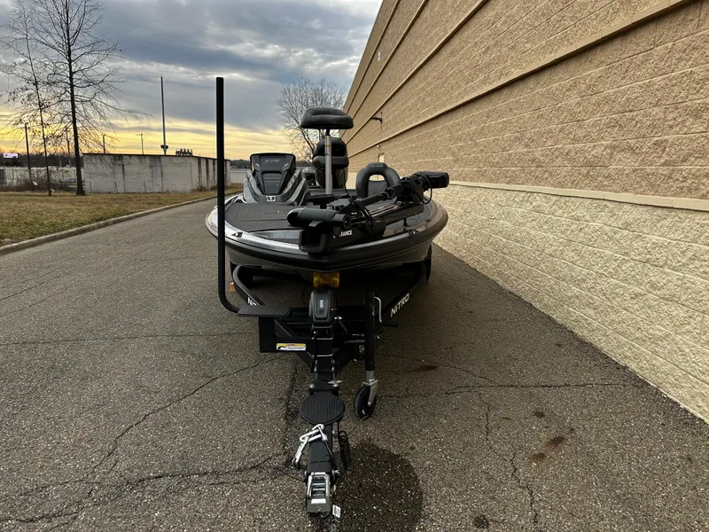 Slide: The Image of 2024 Nitro Z19 Pro fishing boat parked beside a building at sunset. - 4