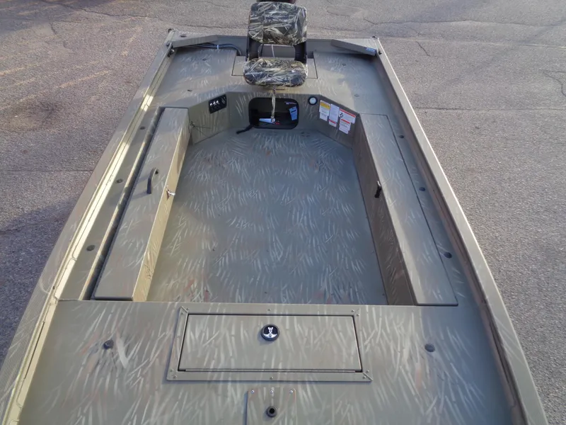 Slide: The Image of 2024 Tracker Grizzly 1654 T Sportsman boat interior with camo seat. - 10