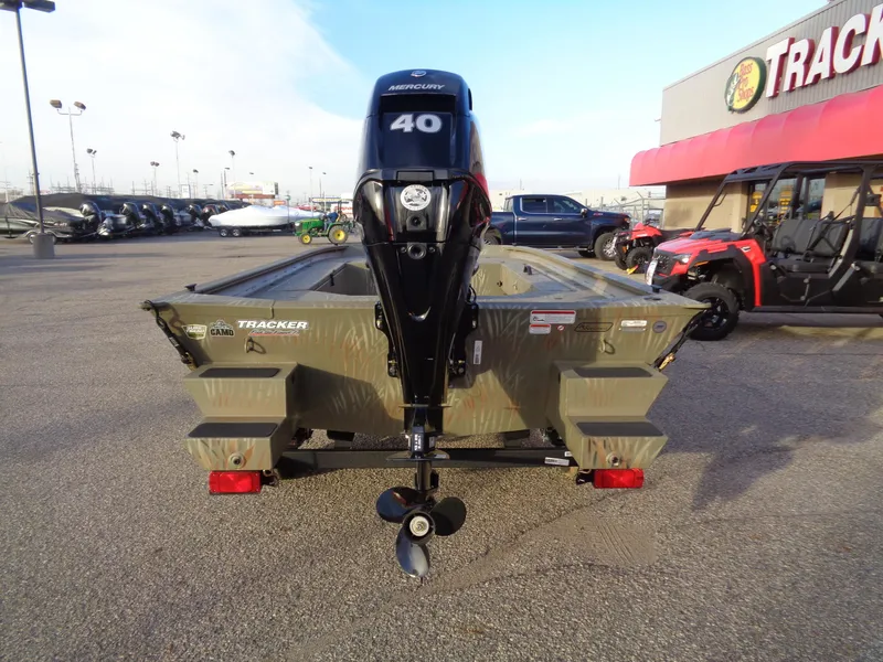 Slide: The Image of 2024 Tracker Grizzly 1654 T Sportsman boat with Mercury 40 engine, rear view. - 6