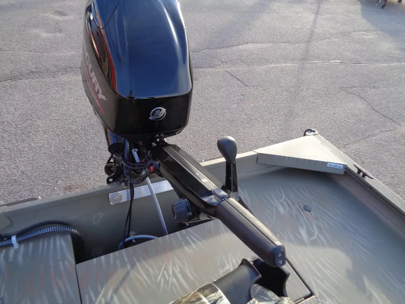 Slide: The Image of 2024 Tracker Grizzly 1654 T Sportsman boat with Mercury outboard motor. - 7