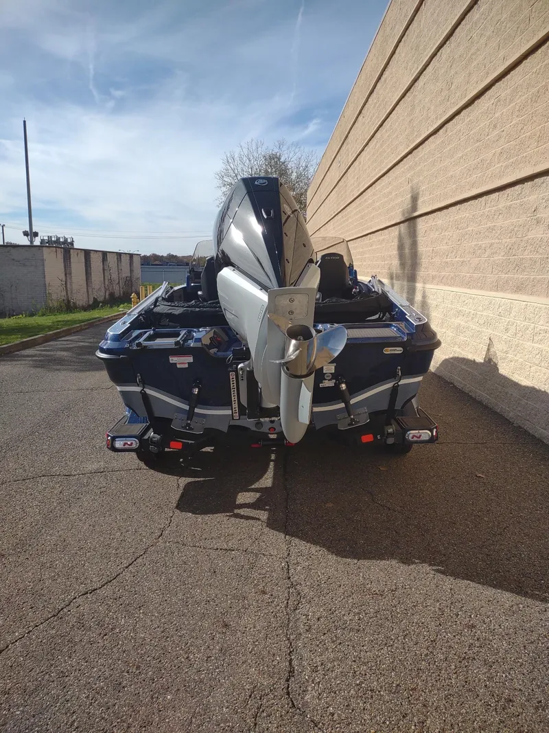 Slide: The Image of 2024 Nitro ZV21 Pro boat parked outdoors, rear view. - 3