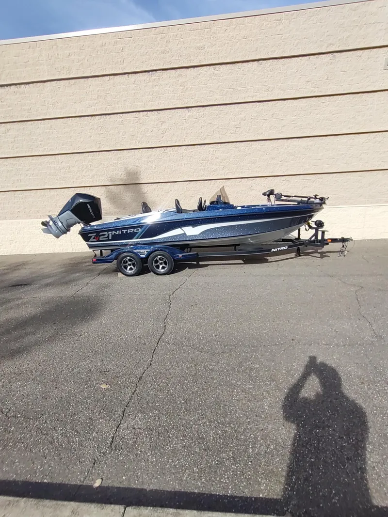 Slide: The Image of 2024 Nitro ZV21 Pro boat on trailer, parked outdoors. - 5