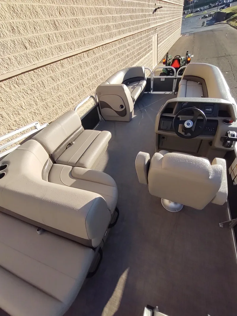 Slide: The Image of 2024 Sun Tracker Party Barge 20 DLX with spacious seating and modern helm. - 5