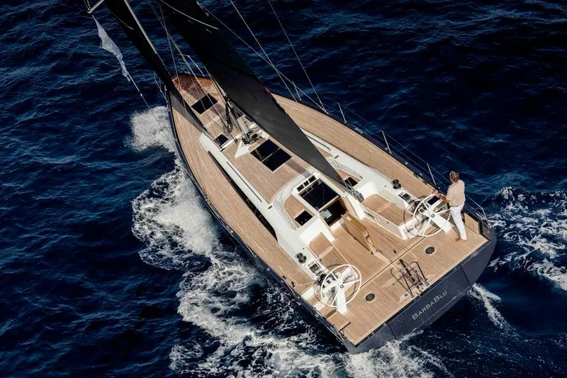Slide: The Image of Modern Solaris 40 yacht sailing on open sea, 2025 model, with sleek design and wooden deck. - 3