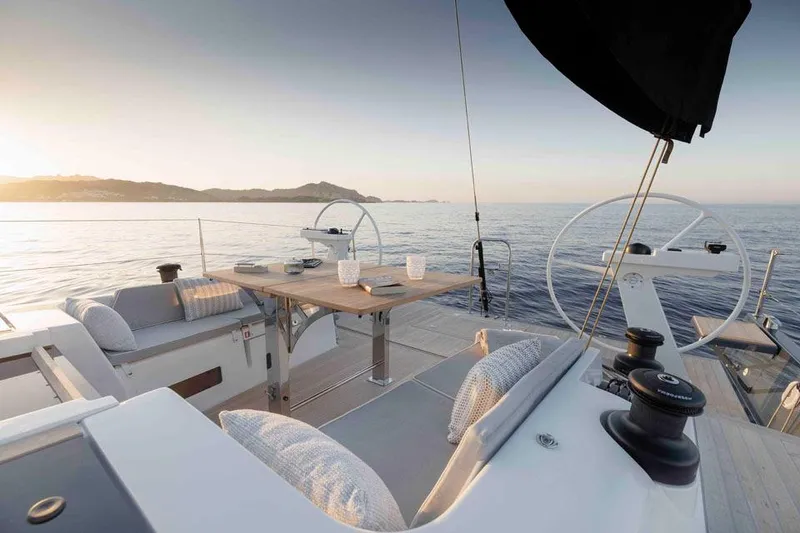 Slide: The Image of Luxurious Solaris 40 yacht deck at sunset, 2025 model, with elegant seating and ocean view. - 5