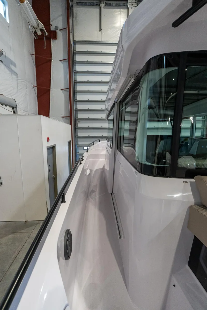 Slide: The Image of 2024 Axopar 37 Cross Cabin XC in a storage facility. - 10