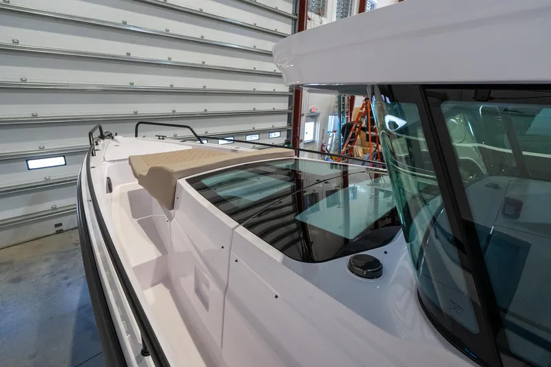 Slide: The Image of 2024 Axopar 37 Cross Cabin XC in a storage facility. - 11