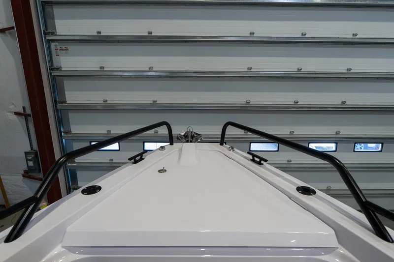 Slide: The Image of 2024 Axopar 37 Cross Cabin XC bow view in a storage facility. - 13