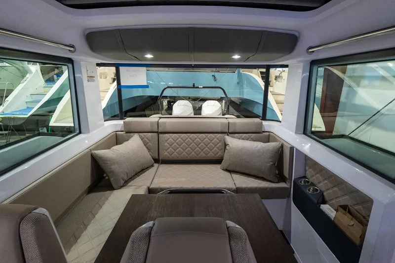 Slide: The Image of Interior of 2024 Axopar 37 Cross Cabin XC, featuring luxurious seating and modern design. - 28