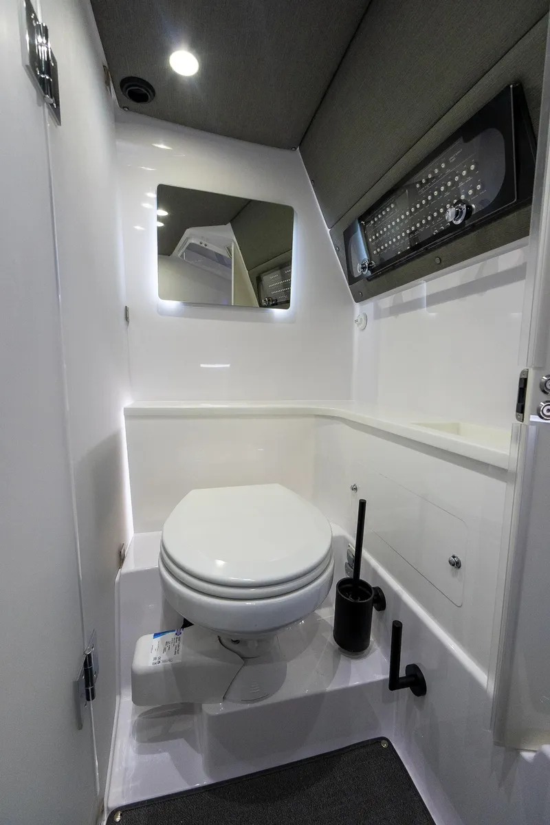 Slide: The Image of 2024 Axopar 37 Cross Cabin XC bathroom with modern fixtures and sleek design. - 39