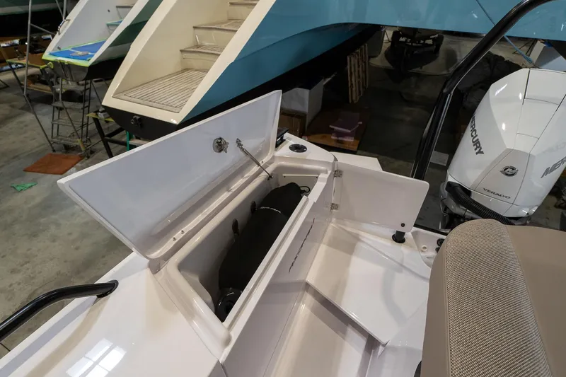 Slide: The Image of Storage compartment of the 2024 Axopar 37 Cross Cabin XC boat in a showroom. - 8