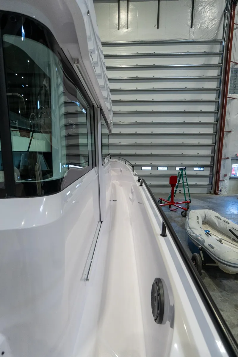 Slide: The Image of 2024 Axopar 37 Cross Cabin XC in a storage facility. - 9