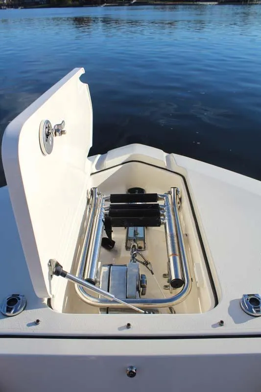 Slide: The Image of 2018 Scout 275 Dorado boat anchor storage compartment with open hatch. - 19