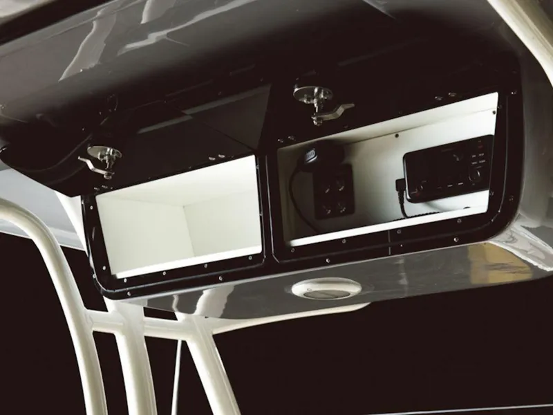 Slide: The Image of 2024 Key West 263 FS boat storage compartments and electronic panel. - 3