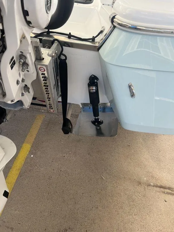 Slide: The Image of 2024 BlackJack 256 Bay boat with trim tab and motor mount detail. - 10
