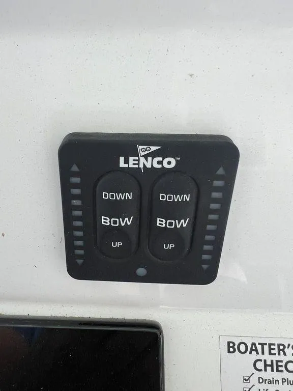 Slide: The Image of Lenco trim tab control panel on 2024 BlackJack 256 Bay boat. - 26