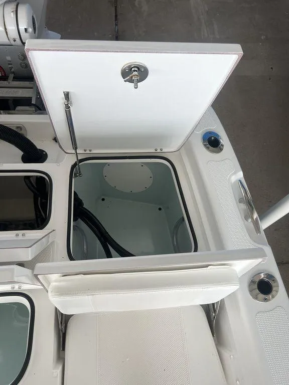 Slide: The Image of 2024 BlackJack 256 Bay boat storage compartments with open hatches. - 29