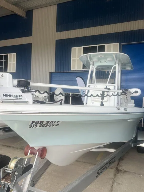 Slide: The Image of 2024 BlackJack 256 Bay boat for sale, equipped with Minn Kota trolling motor. - 3