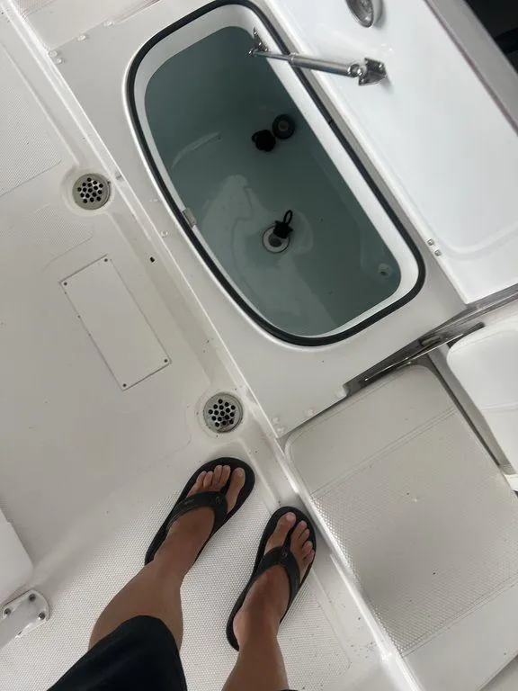 Slide: The Image of 2024 BlackJack 256 Bay boat interior with livewell and deck view. - 31