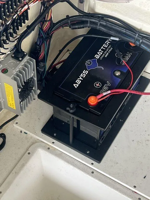 Slide: The Image of 2024 BlackJack 256 Bay boat battery setup with Abyss Battery and wiring. - 4
