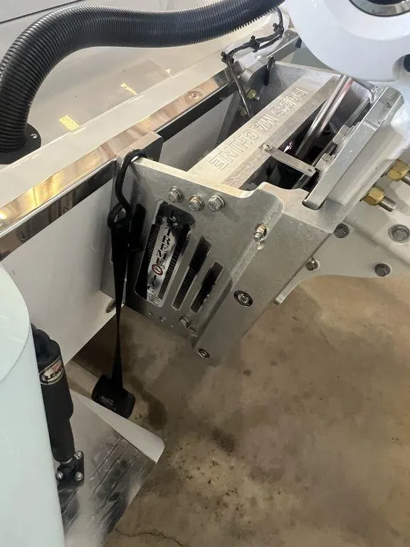 Slide: The Image of 2024 BlackJack 256 Bay boat engine mount detail with hydraulic components. - 9