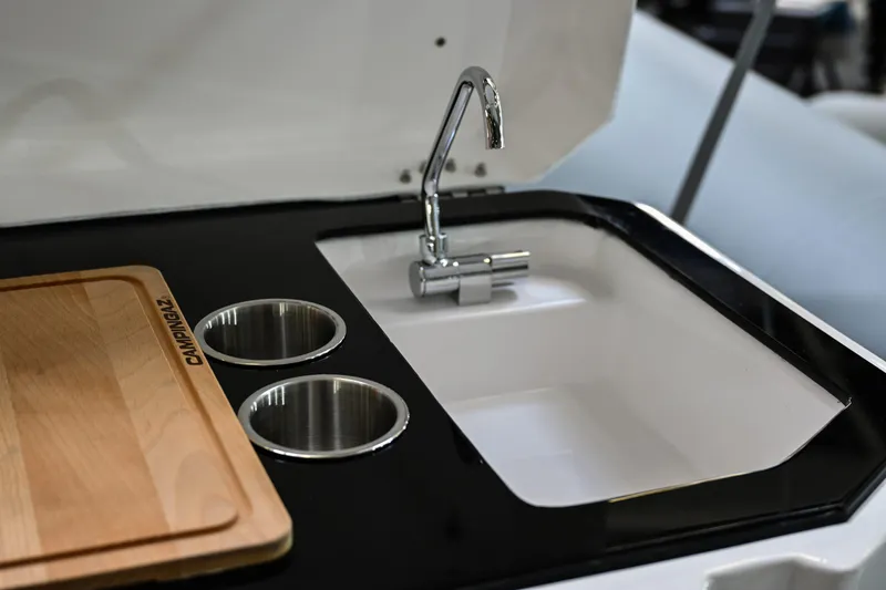 Slide: The Image of Sea Prop COMFORT 30 2024 boat kitchen sink with faucet and cutting board. - 11