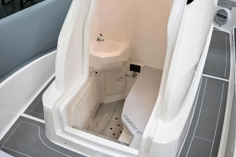 Slide: The Image of Interior of 2024 Sea Prop COMFORT 30 boat featuring a compact bathroom. - 12