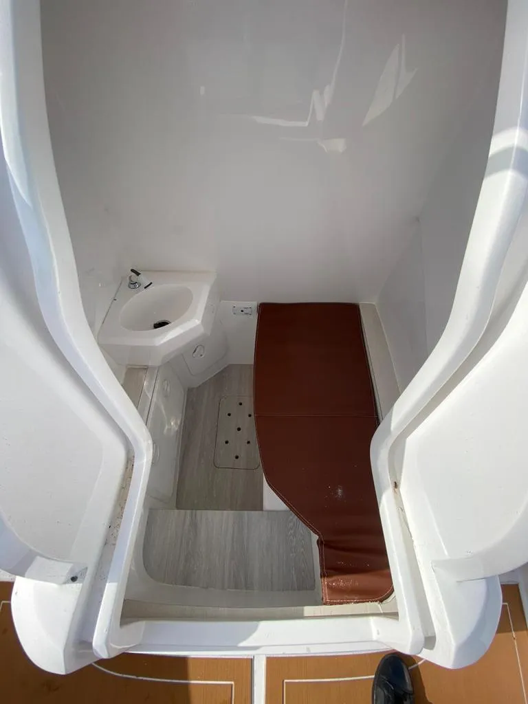 Slide: The Image of 2024 Sea Prop COMFORT 30 boat interior with compact bathroom and sink. - 15