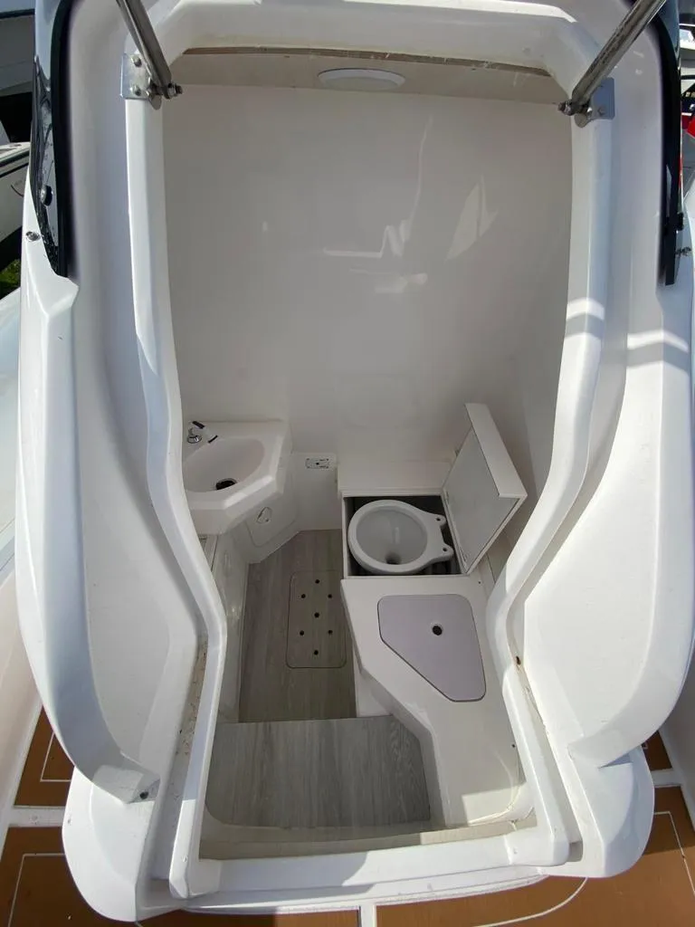Slide: The Image of Interior of 2024 Sea Prop COMFORT 30 boat with compact bathroom amenities. - 16