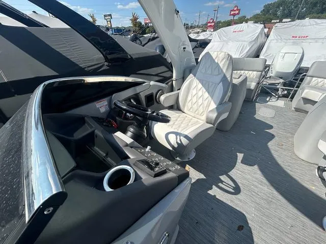 Slide: The Image of 2023 Bennington 25 RFBWA Tritoon interior with luxurious gray seating and modern design. - 10