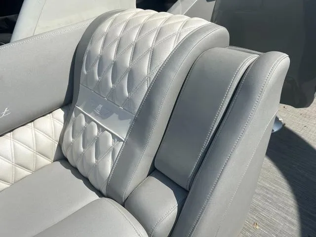 Slide: The Image of 2023 Bennington 25 RFBWA Tritoon quad bench with elegant quilted upholstery. - 23