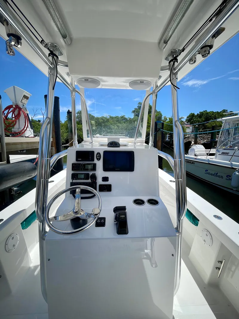 Slide: The Image of 2019 Rambo 27 boat cockpit with steering wheel and navigation equipment. - 1