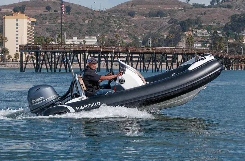The Image of 2024 Highfield SP390 inflatable boat cruising on water with Yamaha outboard motor. - 1