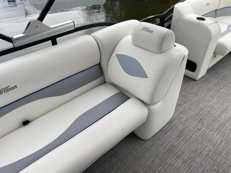 Slide: The Image of 2023 JC NEPTOON SPORT 21TT boat interior with white and gray seating. - 10