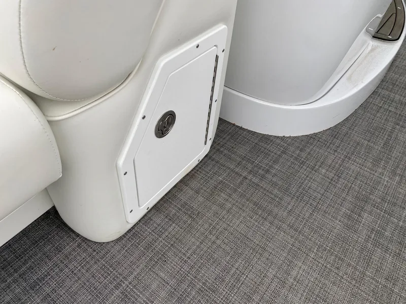 Slide: The Image of Interior detail of 2023 JC NEPTOON SPORT 21TT boat showing storage compartment and seating. - 6