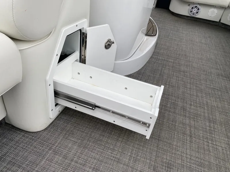 Slide: The Image of 2023 JC NEPTOON SPORT 21TT boat interior with open storage drawer. - 7