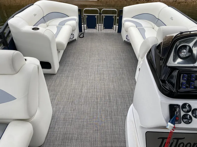Slide: The Image of 2023 JC NEPTOON SPORT 21TT pontoon boat interior with plush seating and modern dashboard. - 9