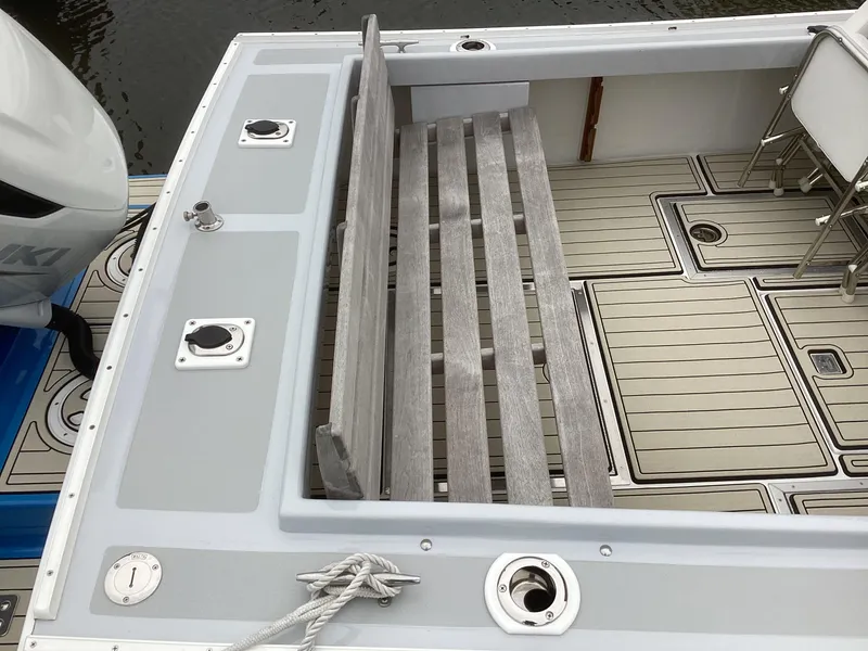 Slide: The Image of 1993 Ellis Downeast Hardtop boat with wooden bench and deck. - 15